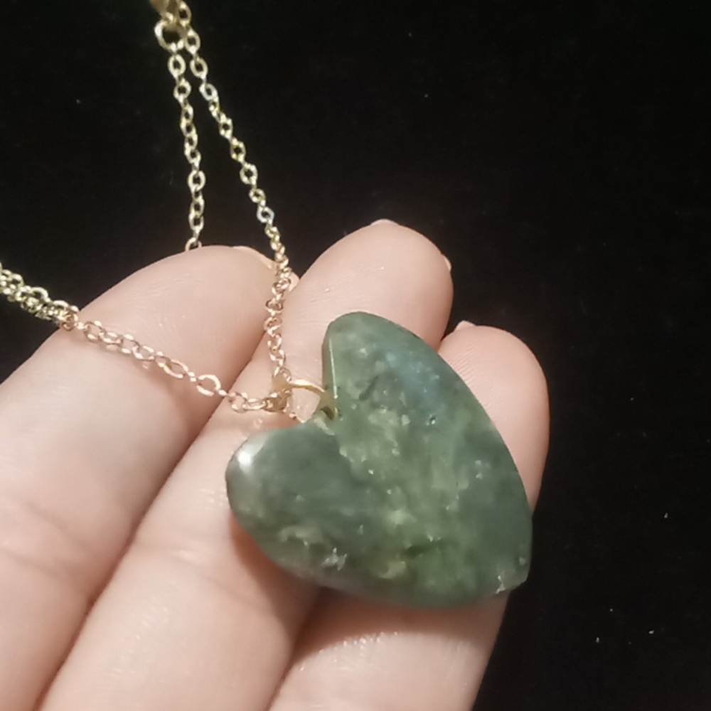 Jade Nephrite genuine heart pendant on a gold tone 36 inch chain.
